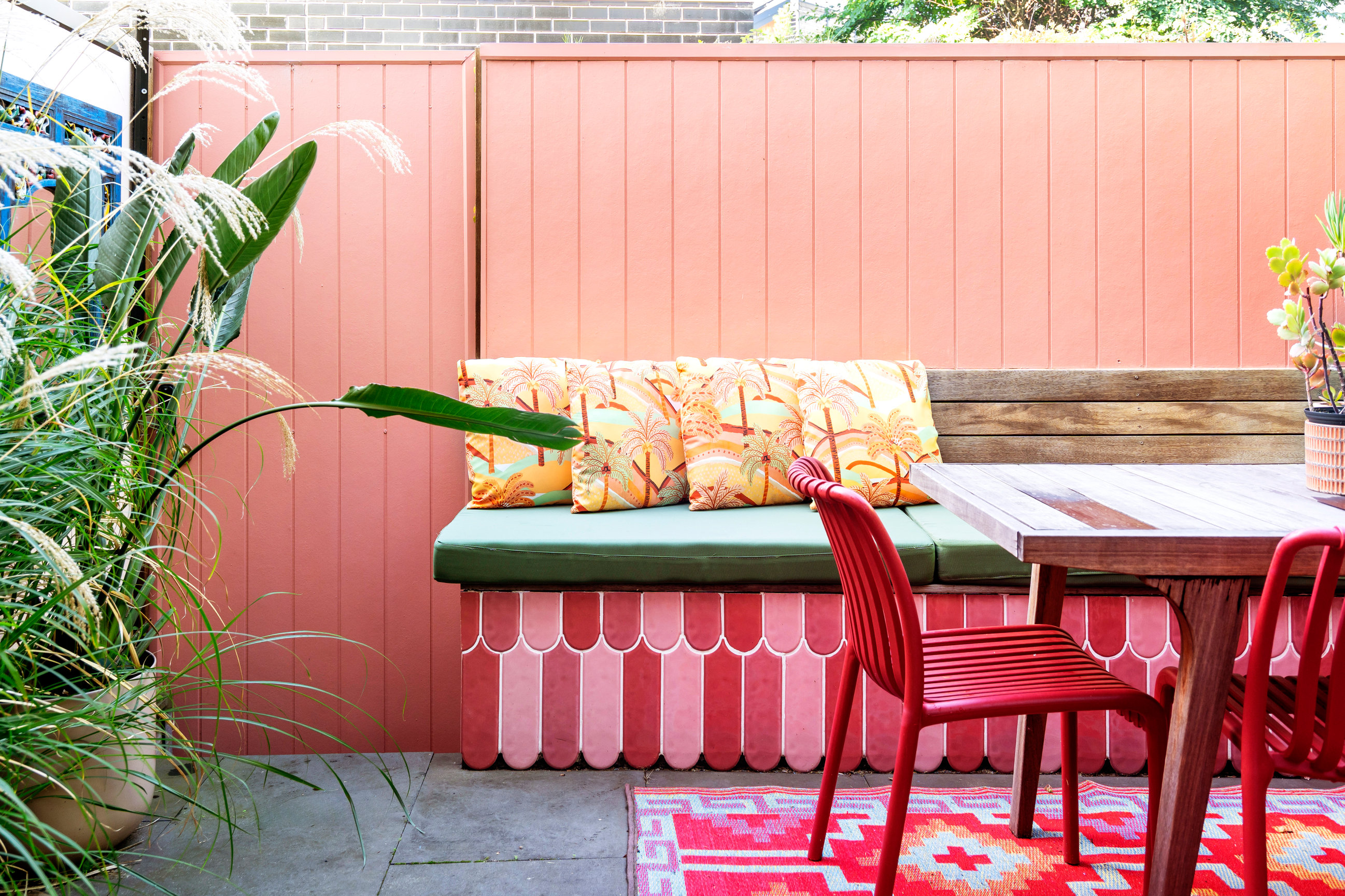 Styled outdoor guest courtyard at a managed short-term rental